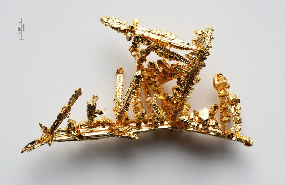 Gold crystals under magnification. From atomic structure to a material with measurable physical properties.